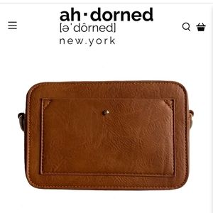Ah-dorned vegan camera bag with strap